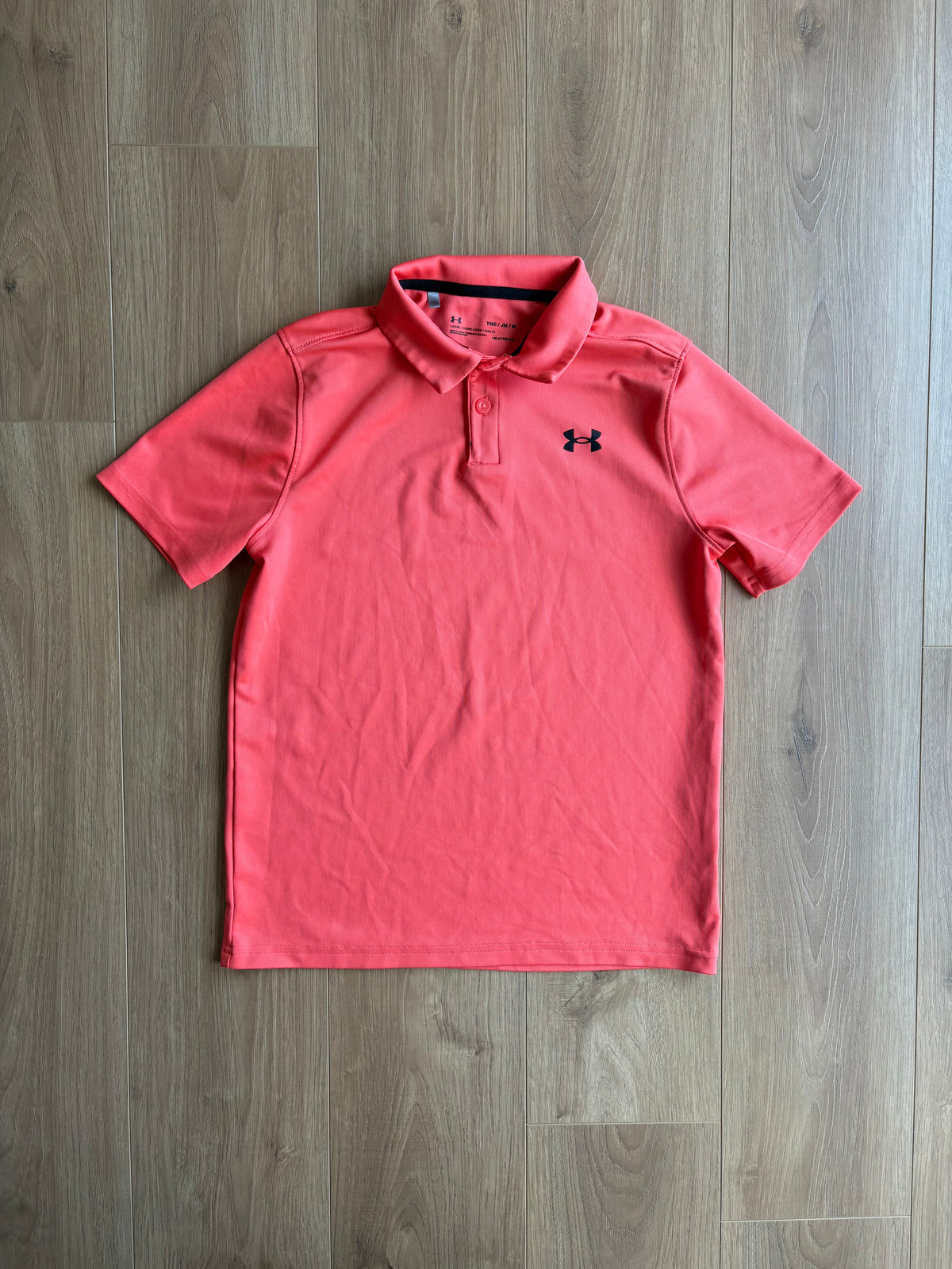 *Léger imparfait* polo dry fit - Under Armour - 10/12 ans